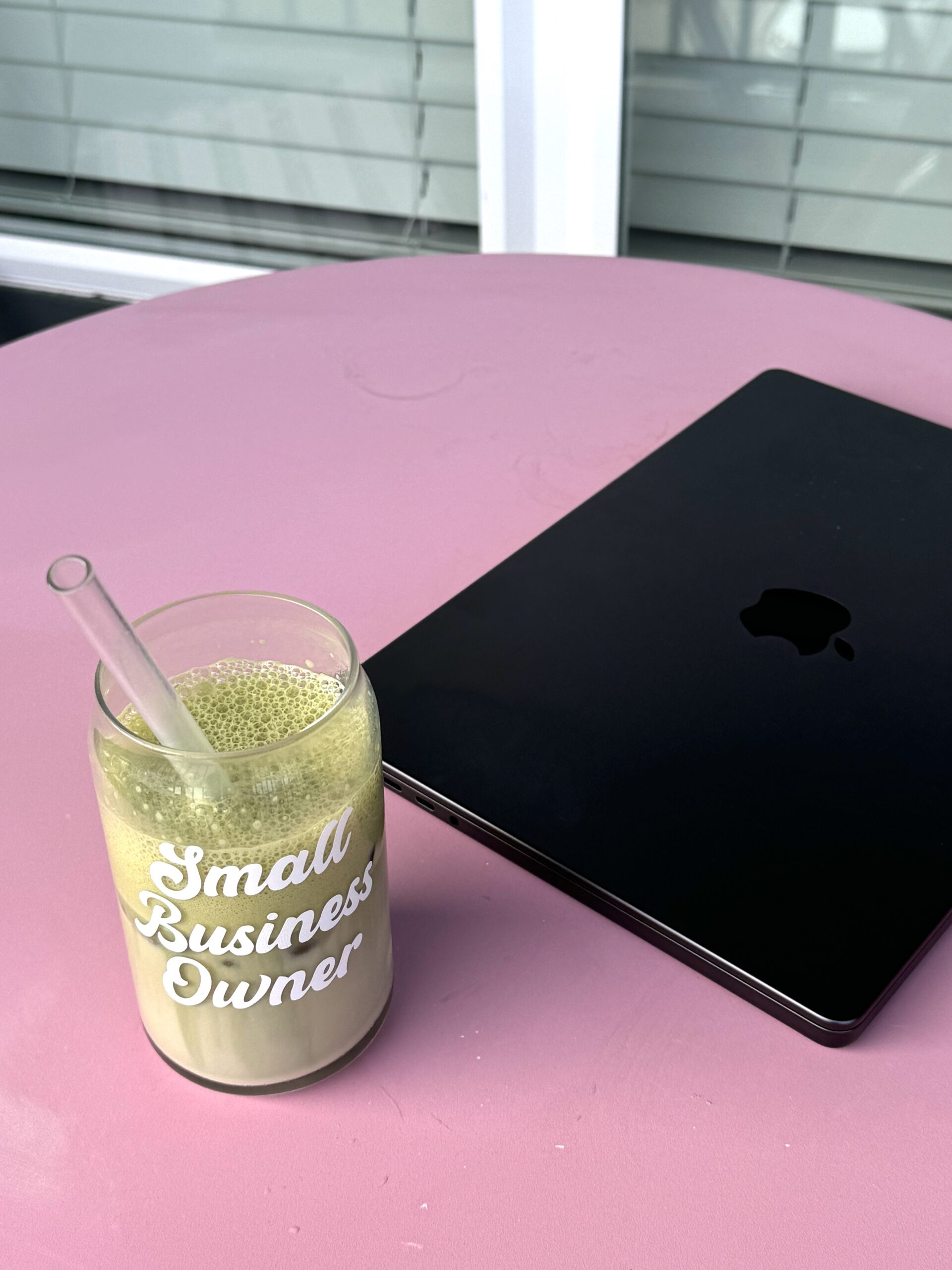 Laptop with small business owner glass